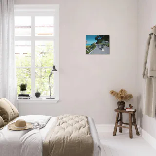 Small canvas print displayed on a bedroom wall.