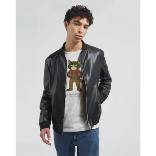 Model wearing a white T-shirt with cat illustration under a black jacket