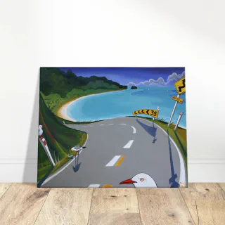 Canvas print featuring a coastal road, turquoise bay, green hills, sandy beach, road signs, and seagulls.