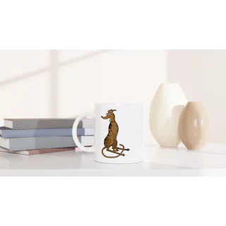 White mug with brindle greyhound illustration on a shelf beside books and vases