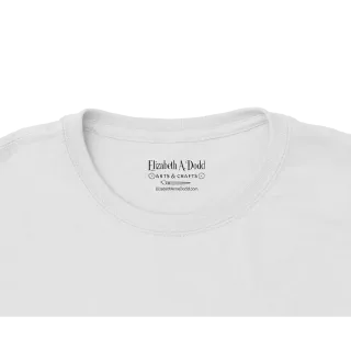 Close-up of the neckline and inner printed label on a white crewneck T-shirt