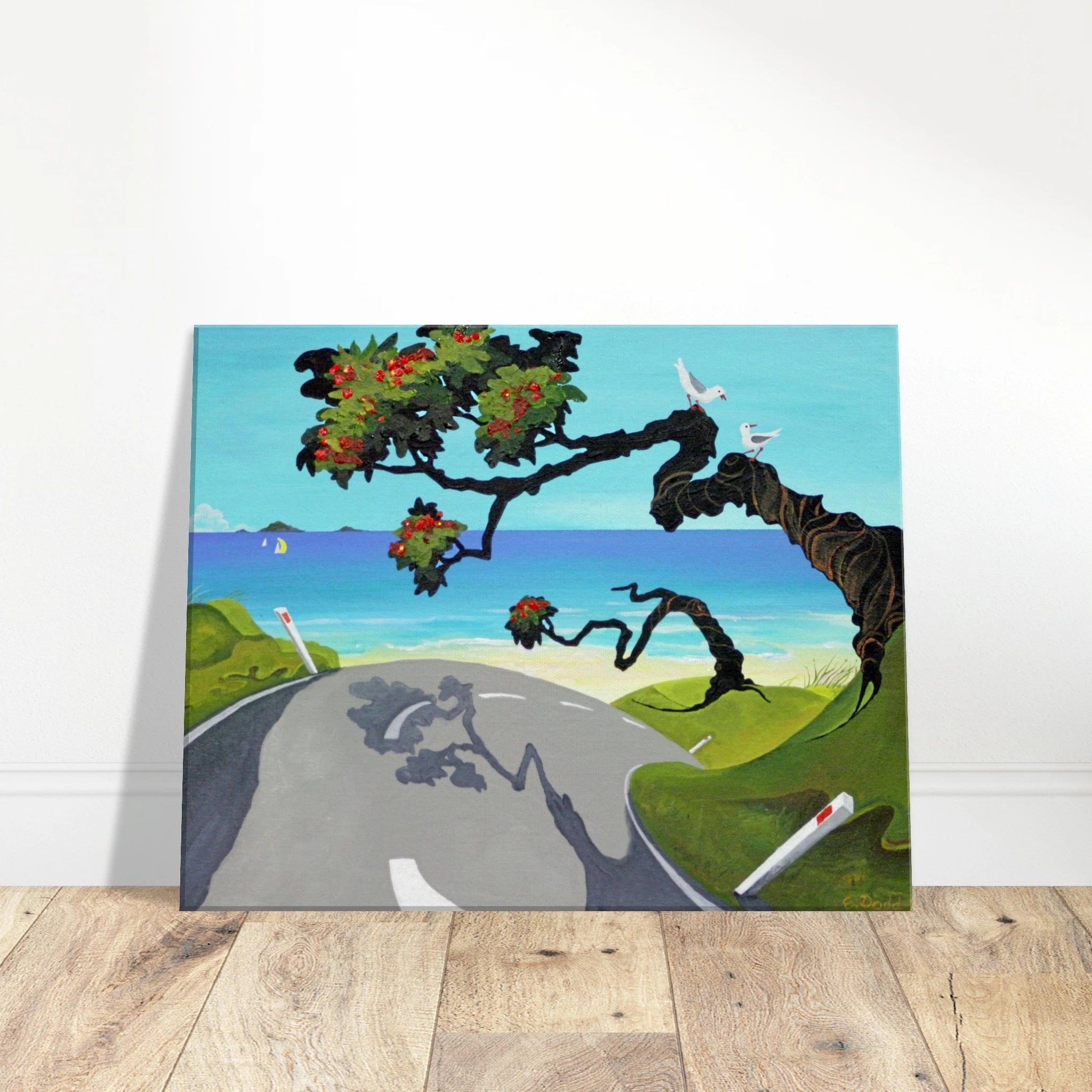 Square canvas print leaning against a white wall on a wooden floor