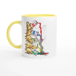 White mug with yellow handle and black interior featuring illustration of stacked tabby cats tipping paint cans
