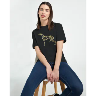 Woman sitting on a stool wearing a black t-shirt with a gold greyhound graphic and blue jeans