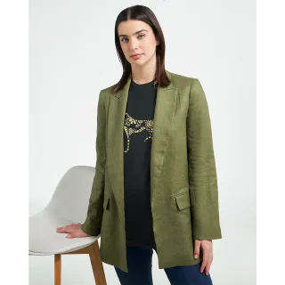 Woman wearing a black t-shirt with a gold greyhound graphic under a green blazer
