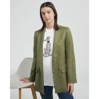 Woman wearing a white t-shirt with a grey greyhound illustration under a green blazer