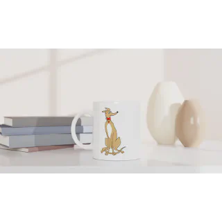 White ceramic mug with light tan greyhound illustration on a tabletop beside books and vases