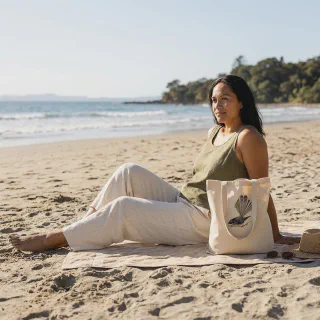 Angled natural tote bag with New Zealand fantail design