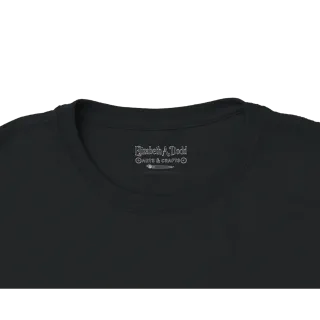 Close-up of the collar label on a black women's crewneck T-shirt
