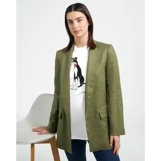 Model wearing a green jacket and white T-shirt with black-and-white greyhound design